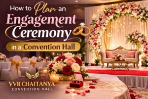 Beautiful engagement ceremony setup at VVR Chaitanya Convention Hall with floral stage decoration and elegant lighting.